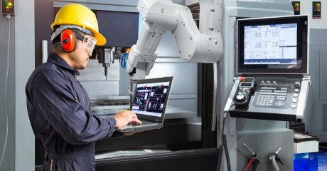 Man at machining station | Custom Tool Inc